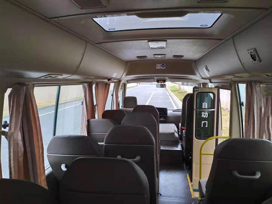 Guangzhou equipped driver rental 23 seat Toyota Coaster minibus rental company